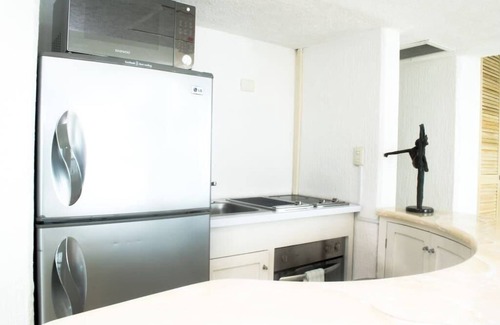 Zona Hotelera Condo | breathtaking studio, w/ocean and lagoon views, amazing wrap around balcony,.