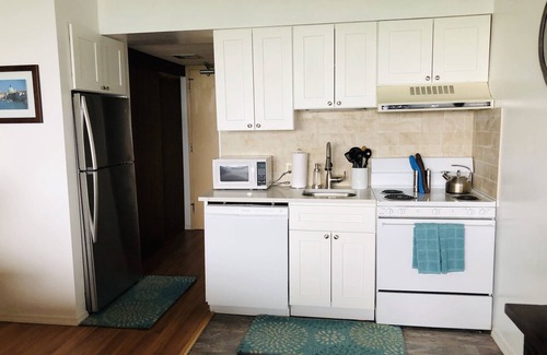 Weirs Beach Condo | Breathtaking views! Kitchen! King bed! Summer Concerts!