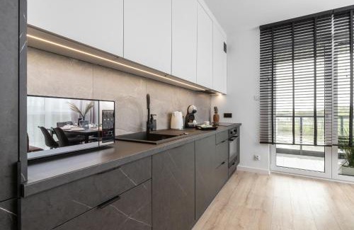 Nowy Port Apartment | Bright & Modern Apartment with Parking near Arena Gdansk by Noclegi Renters
