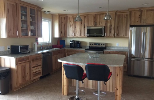 Carova Beach House | Canal front. 4WD area. Hot tub. Screened-in porch. Large deck. Game room.