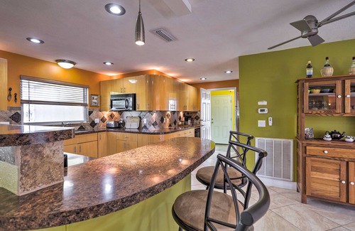 Skylark Estates Cottage | Canal-front Merritt Island Home w/Deck + Grill!