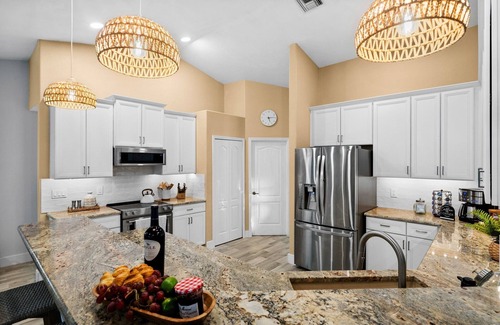 Pelican Villa | Canal-Front Oasis: Pool, Games, EV Charger