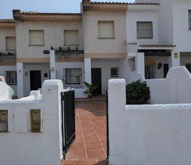 Sector O - Ostrero House | Chalet adosado en Matalascañas con piscina y chimenea, cerca de la playa
