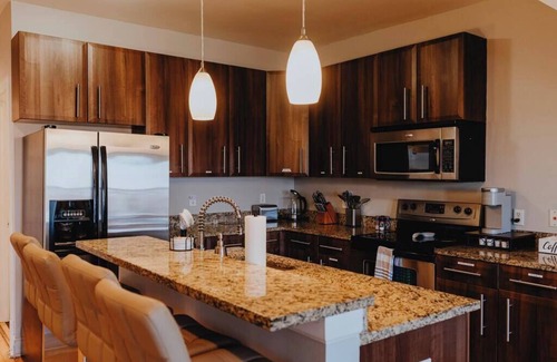 The Gate Apartment | Charming 1BR Retreat Opposite SSM SLU Hospital with Private Parking & Balcony