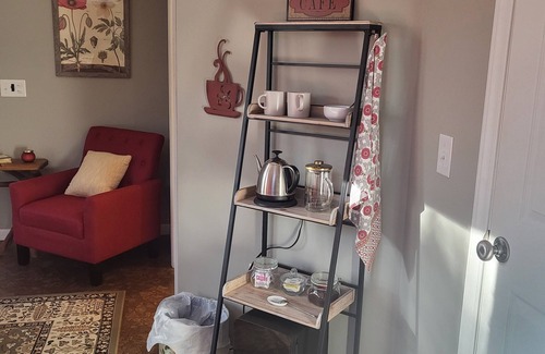 Bear Creek House | Charming bedroom and bath with private entrance and screened porch .