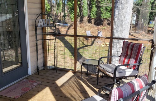 Bear Creek House | Charming bedroom and bath with private entrance and screened porch .