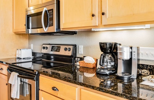 Three Lakes Condo | Charming lakefront condo with pool, fireplace, hot tub, golf, & washer/dryer