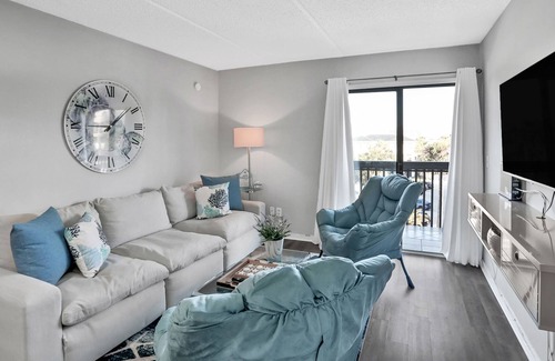 Neptune Beach Condo | Charming ocean view condo with kitchen, balcony & beach towels - close to beach