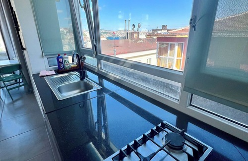 Cihangir Apartment | Charming terrace apartment in historic Istanbul with dreamy Bosphorus views.