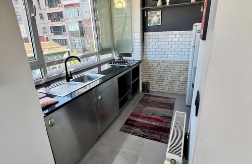 Cihangir Apartment | Charming terrace apartment in historic Istanbul with dreamy Bosphorus views.