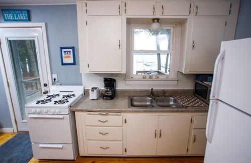 Sturgeon Bay Cottage | Charming Waterfront Cabin on Clark Lake- paddleboat and canoes!