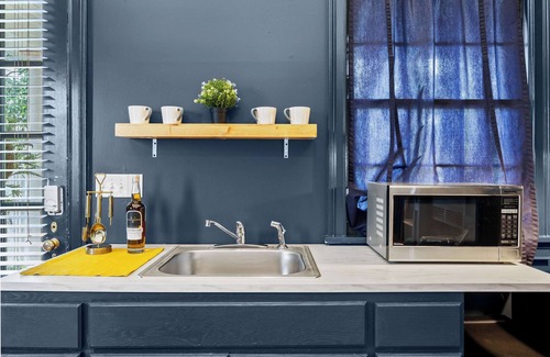 Cherokee Triangle Apartment | Chic Lou Studio | Cozy King Bed + Vibrant Location