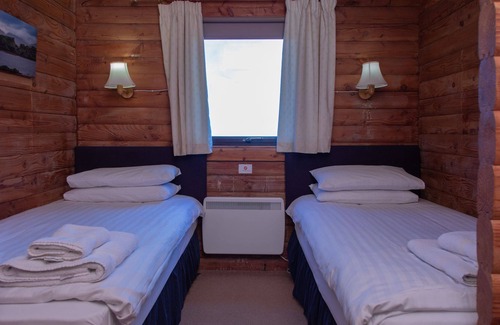 Armadale Ski Chalet | Clanranald Lodge - a cabin that sleeps 6 guests in 3 bedrooms