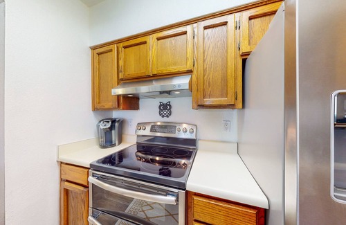 Dietz Condo | Classic condo with a balcony, washer/dryer, central AC, pool