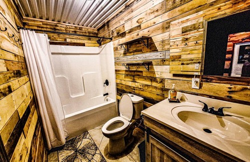 Belle Prairie City Cabin | Comfortable lodging with full bar. Kids stay free!
