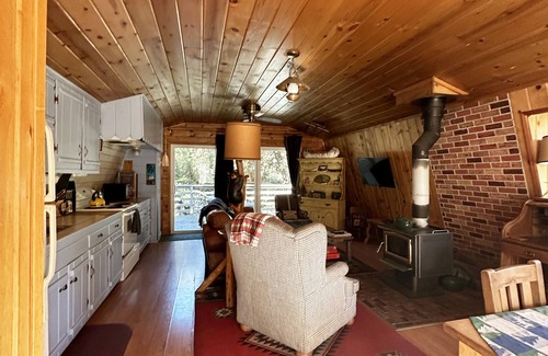 Pine Mountain Club Cabin | Cool off in the beautiful pool. We have AC and Starlink and a cozy wood stove.