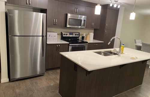 Auburn Bay Condo | Cozy home