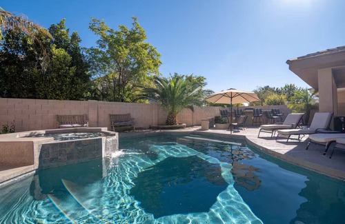 Roosevelt Park House | Custom home with 5 Beds & 5.5 Baths! A heated pool & spa make the backyard feel like a resort