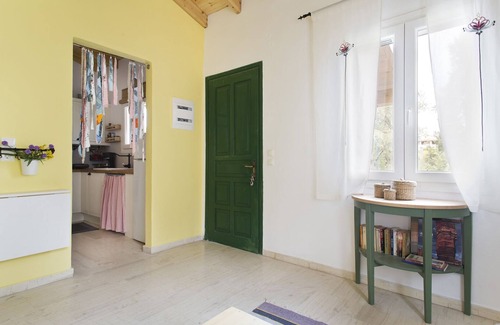 Almiros Beach House | Cute yellow Handmade House with tree garden