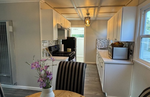 Sunland House | Dog friendly cottage with porch, pool, massive yard, and plenty of parking.