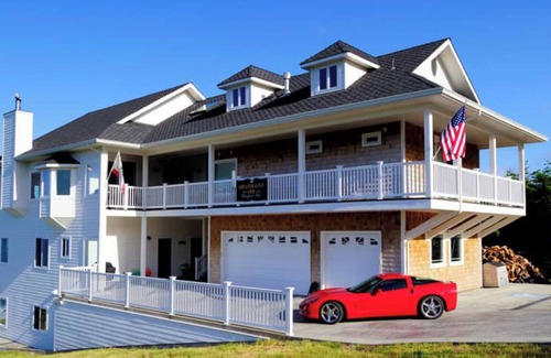 Ocean Shores Condo | Dolphin by OceanviewHotTubs Tesla charging Oceanfront Shelter Coven