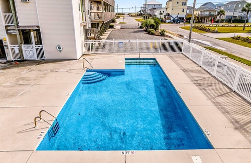 Surf City House | Dreamy ocean-view suite with pool, central AC, full kitchen, patio, & balcony