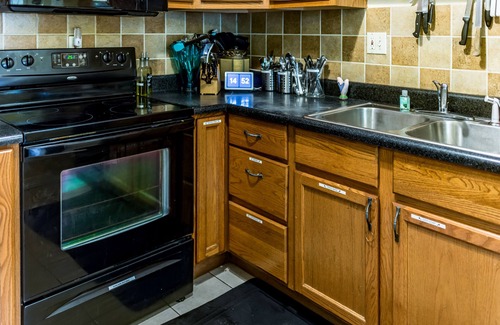 St. Louis House | Elegant home with pool, fenced yard, full kitchen & theater.