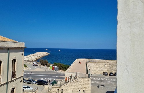 Eastern Sicily Apartment | Elegant old town apartment with sea view and roof terrace