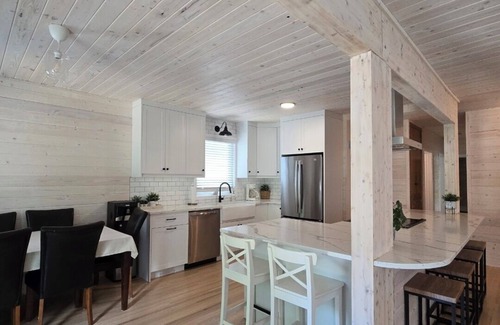 Christopher Lake Cabin | Emma Lake Sunset Bay retreat! One minute walk to the beach with large deck/yard!