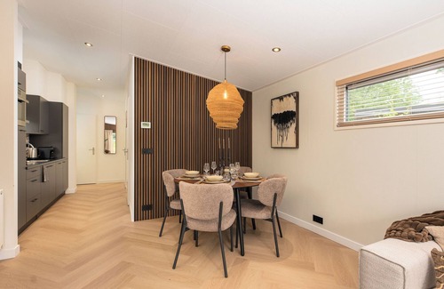 Lieren House | Enjoy a luxury holiday home for 4 people in the wooded nature of the Veluwe, featuring modern amenities, air conditioning, and a stylish pergola for optimal comfort.