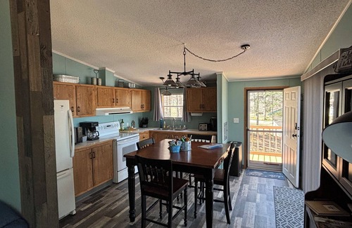 Crandon Cottage | Enjoy Bishop Lake ice fishing along snowmobile trails and garage your sled!