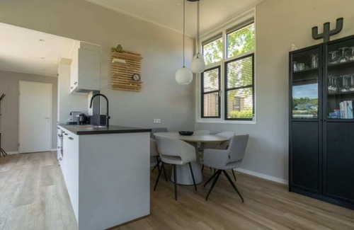 Burgh-Haamstede House | Enjoy the outdoors in this luxury chalet at Duinvilla’s Schouwenduin with a large sliding door, high