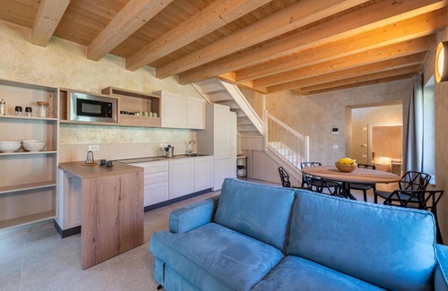 Vesio House | Enjoy your vacation and the view of Lake Garada in this tasteful family farmhouse.