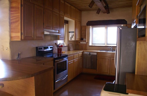 Tyrone House | Escape a cold winter in our large passive solar adobe home with 4 gentle seasons