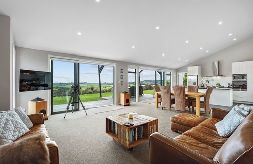 Mangawhai House | Exclusive home with uninterrupted views of the Hen & Chicks, set in Native Bush