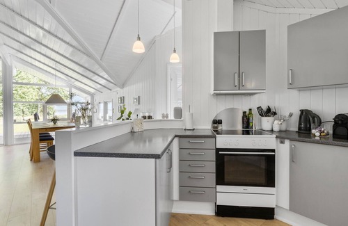 Kirke Hyllinge House | Experience a wonderful break in this holiday home with fjord views.
