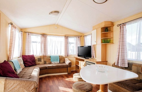 Caister-on-Sea House | Experience comfort and relaxation in our charming caravan, perfect for your next getaway.