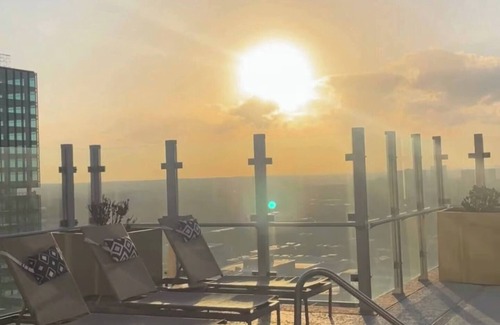 Midtown Apartment | Experience luxury at Royal Escape Midtown, perfectly located for relaxation and adventure. Minutes from top attractions, dining, and corporations, this stylish retreat offers access to a resort-style rooftop pool.