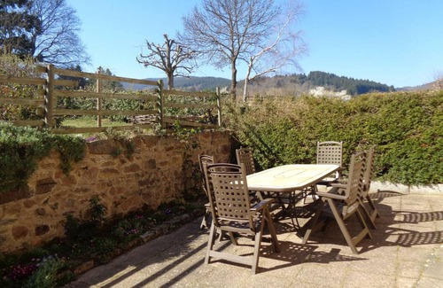 Renaison Cottage | Family cottage with shared pool and fireplace in Renaison