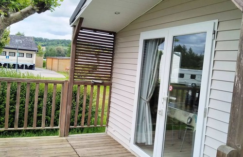 Martigny House | Flower Camping Des 2 Rivières * - Mobile Home Comfort TV - 1 bedroom + semi-covered terrace - 2 to 4 people - 2 people. included in the price
