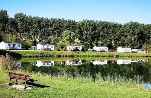 Martigny House | Flower Camping Des 2 Rivières * - Mobile Home Comfort TV - 1 bedroom + semi-covered terrace - 2 to 4 people - 2 people. included in the price