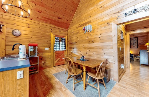 Sevierville Cabin | Forest-view cabin with pool, hot tub, fireplace, deck, & free attraction tickets