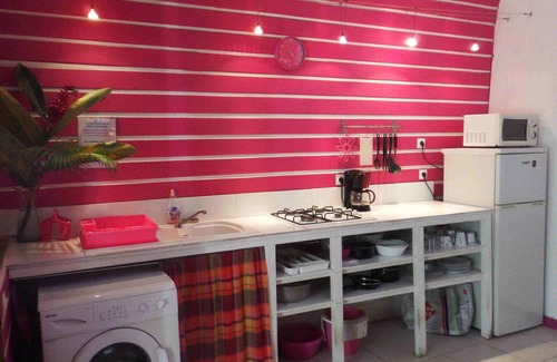 Deshaies Apartment | Fuchsia apartment in a postcard setting overlooking the Caribbean Sea
