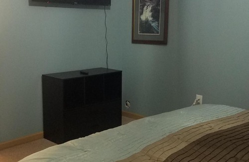 Sandpoint House | Full Suite w/ kitchen, private bedroom, sofa couches and large living area.