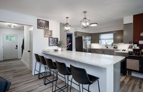 Bryan House | Game-Ready Family Getaway Mini Golf Arcade