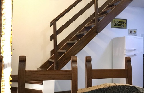 Santa Margherita di Pula House | Giulia terraced house in the shade of pine trees 500 meters from the beach.