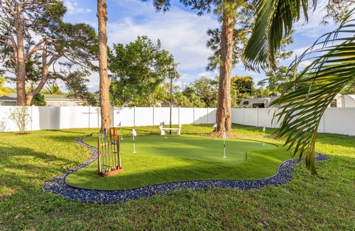 Boynton Beach House | Golfers Green Retreat with 35' Heated Saltwater Pool & Tiki. Pet Friendly!