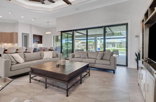 Pelican House | Gorgeous Waterfront Retreat! Stunning Outdoor Space w/Heated Pool, Spa & Outdoor Kitchen!