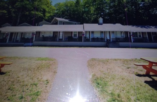 Laconia Resort | Great location with lake views ,pool and private beach.