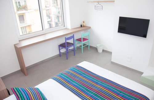Fuorigrotta Apartment | Green apartment with double bedroom and living room / kitchen with sofa bed and private bathroom